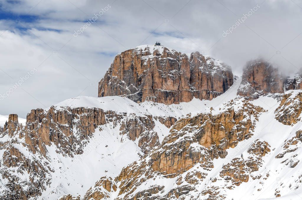 Foggy view of Dolomite Alps and viewpoint of Passo Pordoi near Canazei of Val di Fassa, Trentino-Alto-Adige region, Italy.