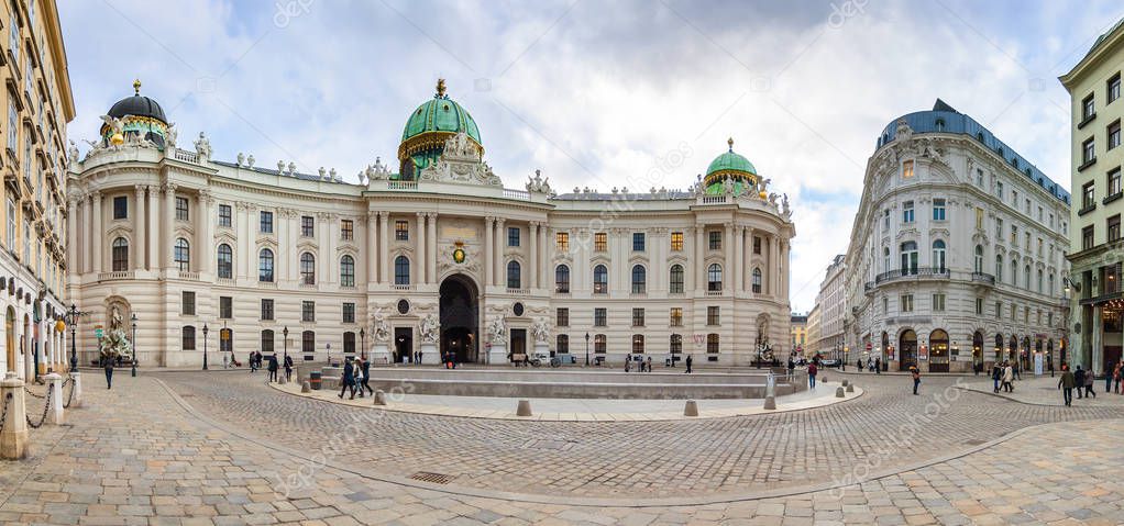 Cloudy panoramic view of Hofburg Palace at Michaelerplatz, Habsburg Empire landmark in Vienna, Austria.