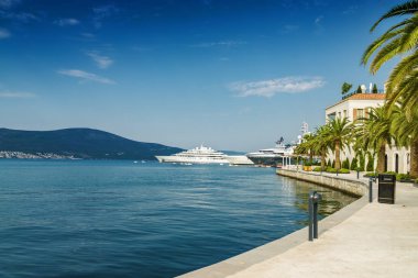 Beautiful embankment on the background of luxury yachts at the p