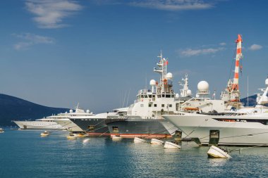 Beautiful embankment on the background of luxury yachts at the p