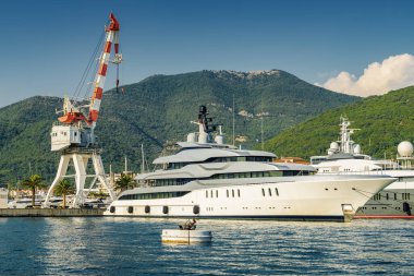 Sunny view of luxury yacht at the port of Tivat, Montenegro.
