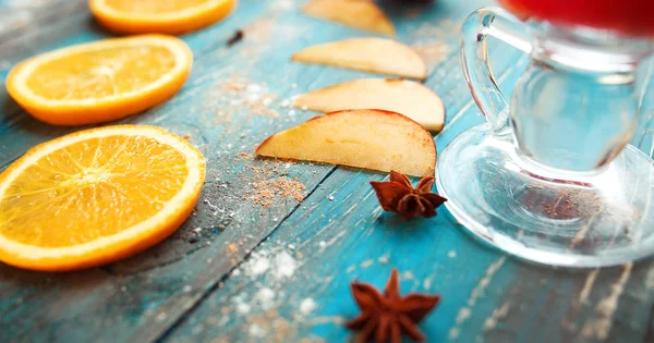 Orange, apple, cinnamon, anise, wine (mulled wine) on wooden background — Stock Photo, Image