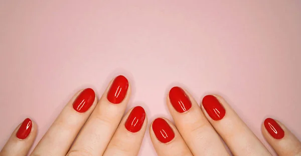 Caucasians hands with red nails — Stock Photo, Image
