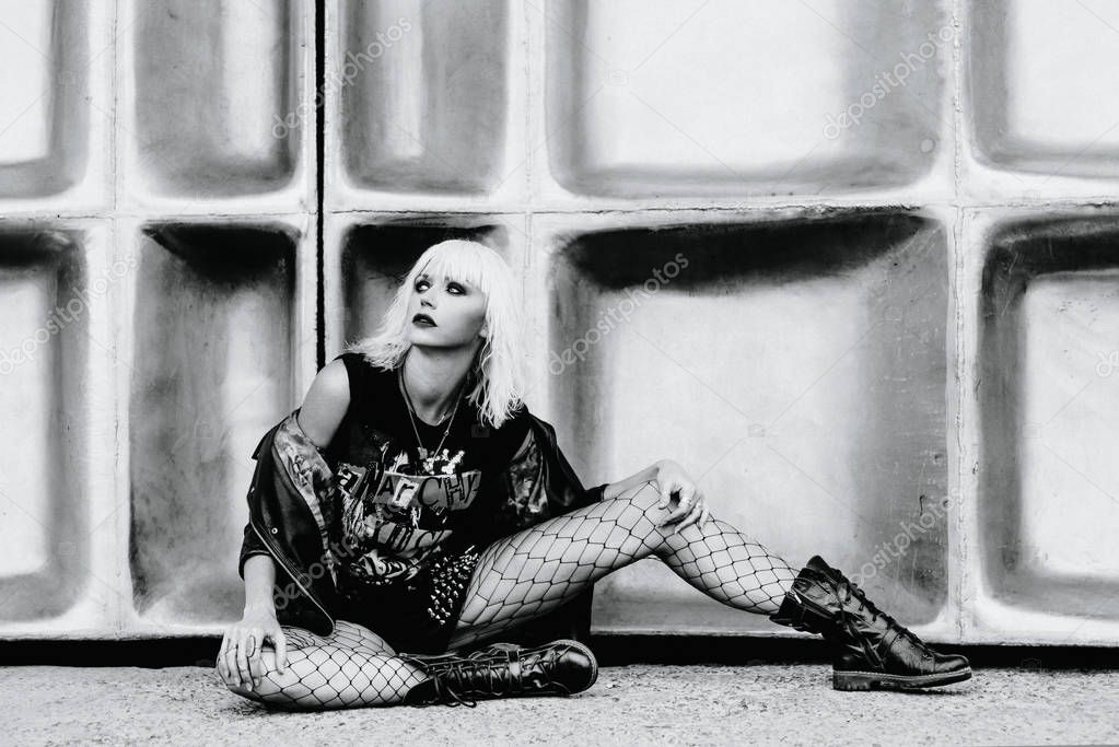 monochrome portrait of stylish blonde grunge young woman 