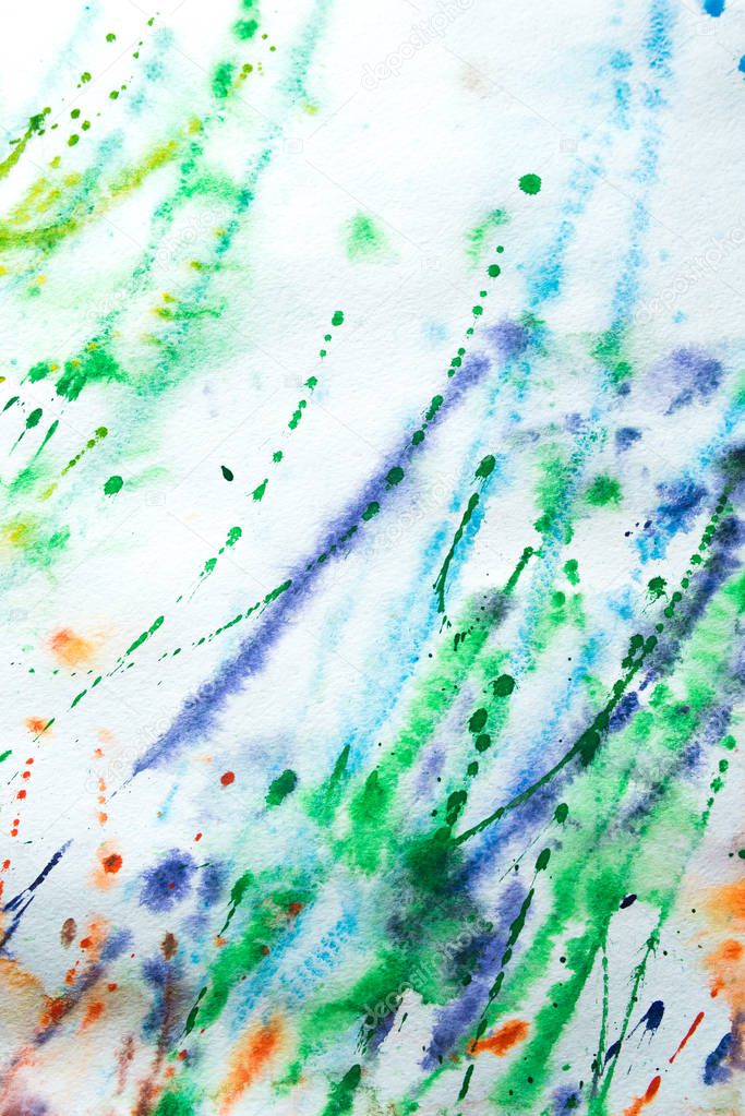 Colorful (blue, green, yellow, orange, red) background of watercolor painting on the paper