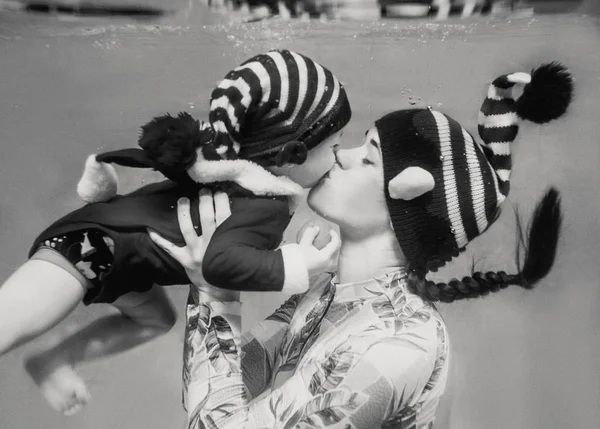 Caucasian Woman Mother Kissing Her Child Infant Underwater New Year Stock Picture