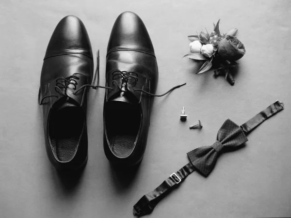 men\'s wedding accessories: shoes, cufflinks, butterfly, boutonniere