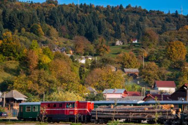 VISEUS DE SUS, ROMANIA - OCTOBER 10, 2014: Mocanita, a steam locomotive fueled by a wood fire, has Viseu de Sus as its starting point and runs for about 60 km to the border with Ukraine crossing the Maramures. Romania, Europe