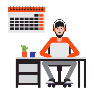 Masada oturan ve dizüstü bilgisayarda çalışan adam.