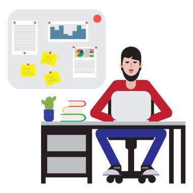 Masada oturan ve dizüstü bilgisayarda çalışan adam.