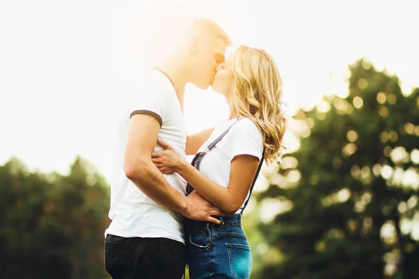 Couple kissing happiness fun. Interracial young couple embracing laughing on date