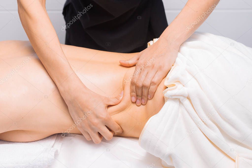 Anti-cellulite massage of thick sides