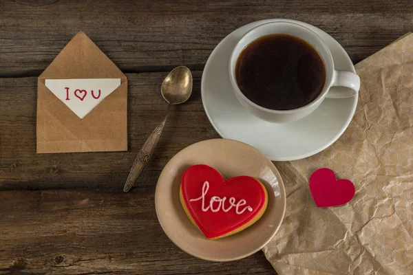 Valentine red cookie with heart shape and cup of coffee — Stock Photo, Image