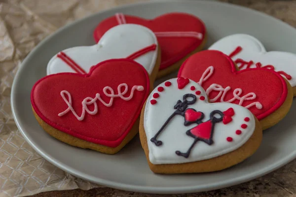 Heart red cookie on a plate for Valentine\'s day
