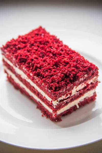 red velvet slice of cake on white plate