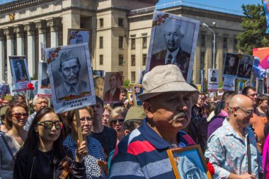 ALMATY, KAZAKHSTAN - MAY 9: Immortal Regiment march during the V clipart