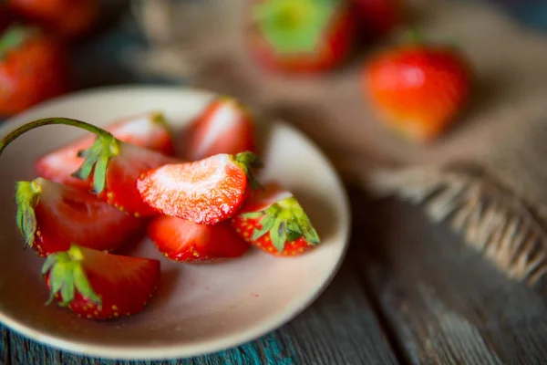 Strawberry on a wooden board in rustic style — Stock Photo, Image