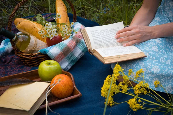 Picnic in nature at summer. Young woman in romantic blue dress i — Stock Photo, Image