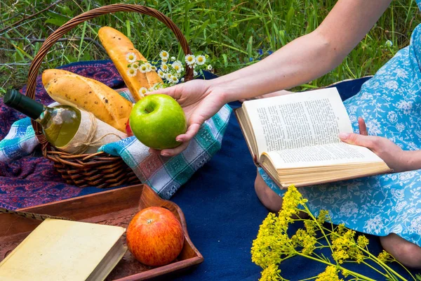 Picnic in nature at summer. Young woman in romantic blue dress i — Stock Photo, Image