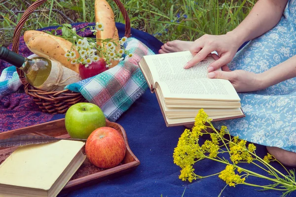 Picnic in nature at summer. Young woman in romantic blue dress i — Stock Photo, Image