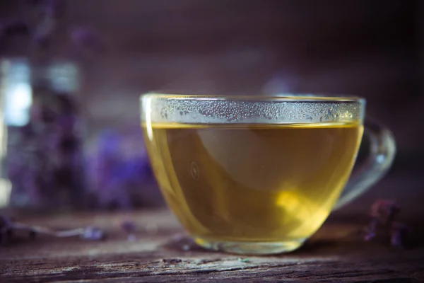 Green tea with herbals. Tea with oregano on the wooden backgroun — Stock Photo, Image