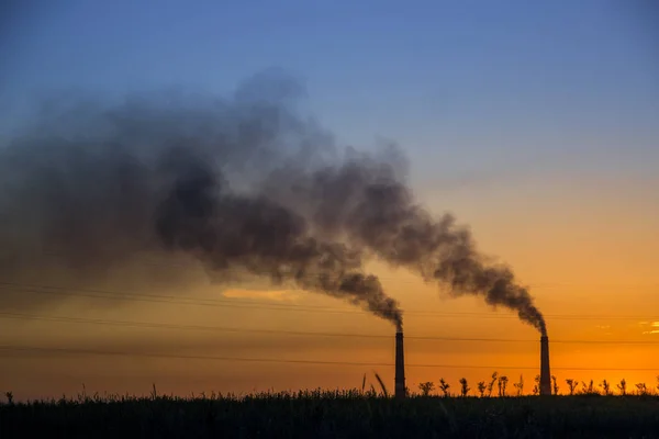 Industrial smoke from chimney at sunset, steppe near Almaty, Kaz — Stock Photo, Image