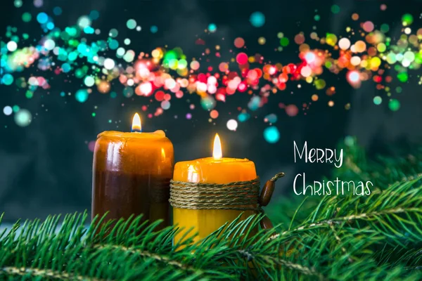 Merry Christmas postcard with candles, fir branches and coloured — Stock Photo, Image