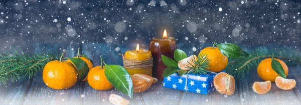 Christmas and new year card with candles, fir branches and manda — Stock Photo, Image