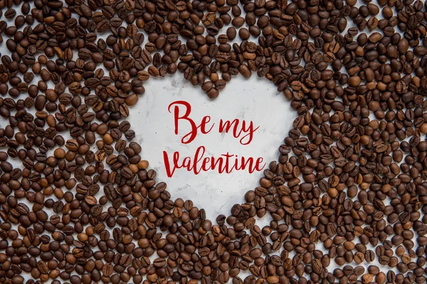Frame heart from coffee beans with text - Be my Valentine