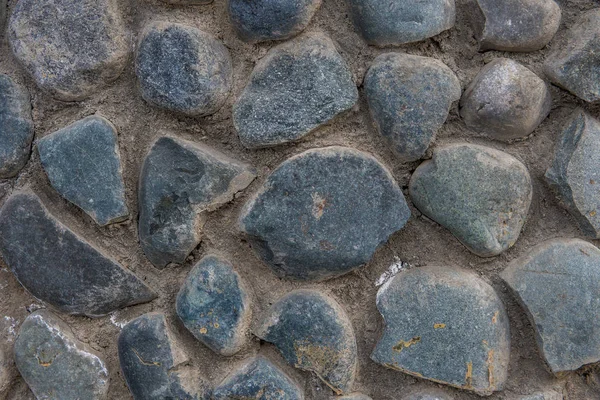Stone wall bakgrund. Konsistens av naturliga stenar — Stockfoto