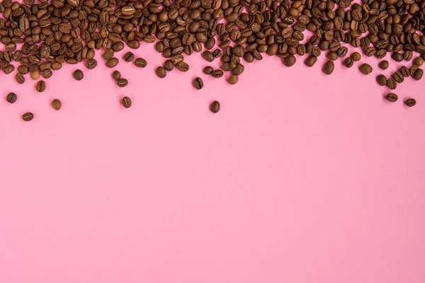 Kahve çekirdekleri bir pembe artalanları tarih alanı Kopyala