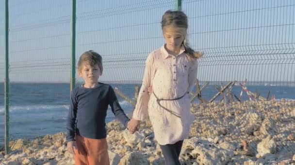 Sad Refugee Children Stand Beach Border Restricted Area Net Fence — 비디오