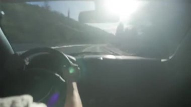 hyperlapse video Driving automobile suburban Road at daylight inside view cabin. hands man control car, high speed. concept travel and trip, driver profession long highway.