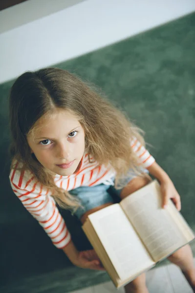 Clever Little Girl Long Hair Sitting Green Sofa Book Her — Stock Photo, Image