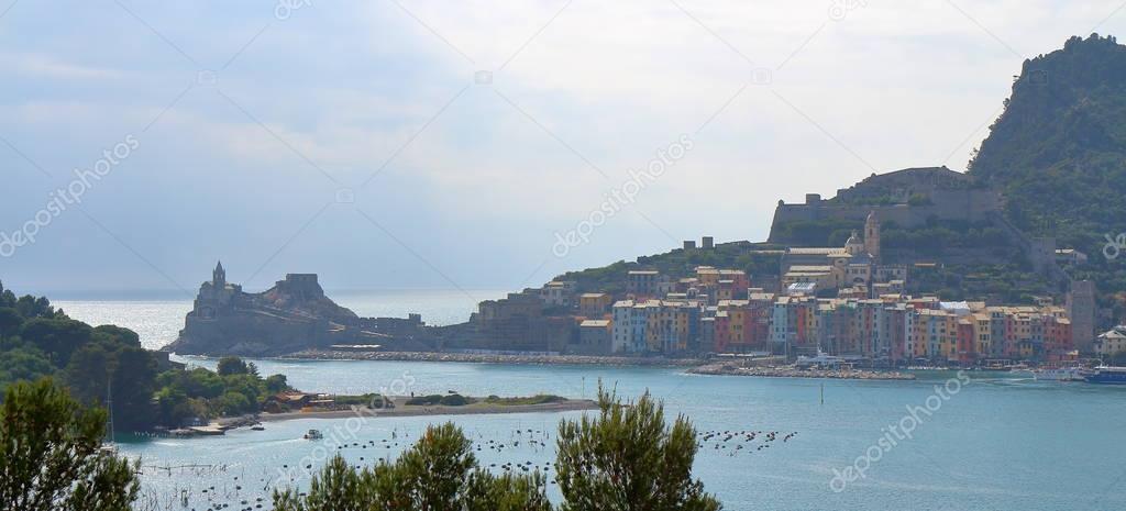 Porto Venere, Italy - May 14, 2017: View of Portovenere or Porto Venere (UNESCO world heritage site), seen from the Island of Palmaria. In the foreground cultivation of mussels. La Spezia, Liguria, Italy