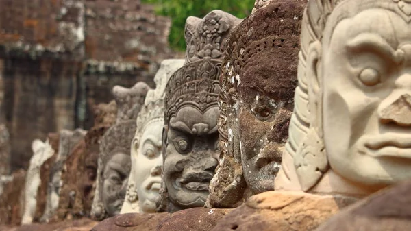 Angels and devils heads at Angkor Thom, Angkor Wat site, Cambodia