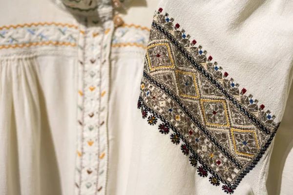 Ukrainian women\'s embroidery. National embroidered pattern on the sleeve of a linen shirt.