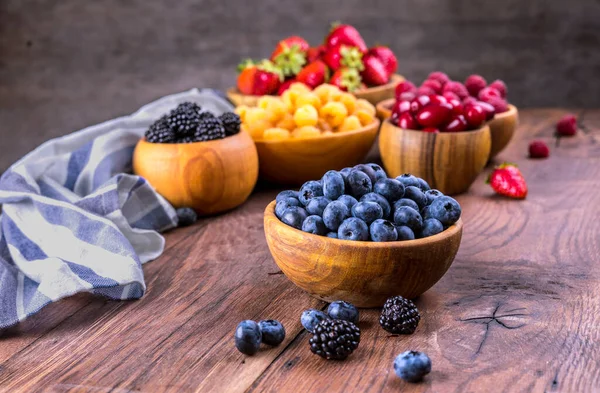 Blueberries Other Berries Bowls Dark Wooden Background — Stock Photo, Image