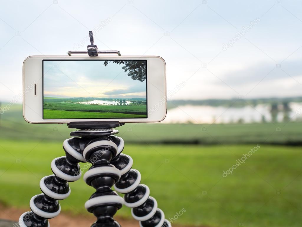 Smartphone take a landscape photo on tripod
