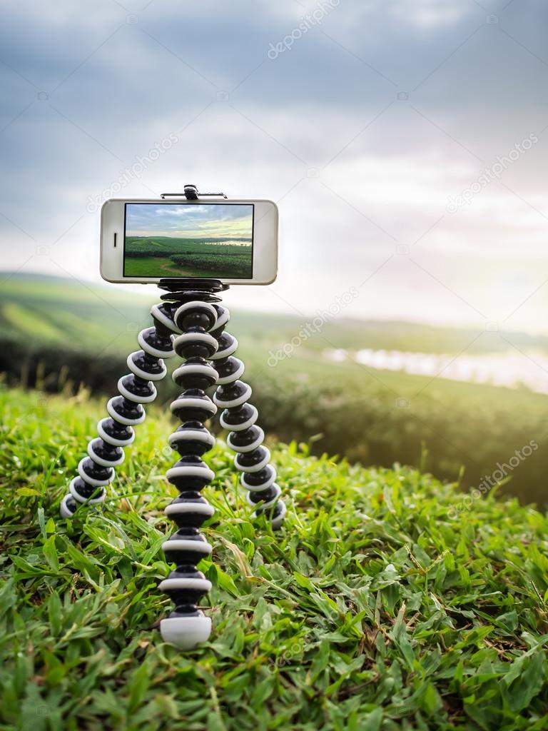 Smartphone take a landscape photo on tripod