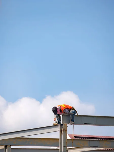 stock image Builder welding on high-rise steel frame