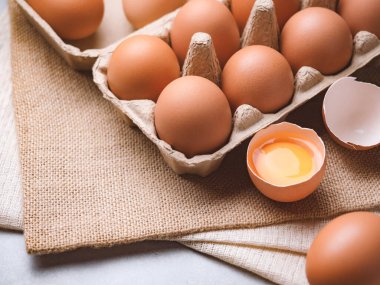 Close up image of organic chicken eggs are one of the food ingredients on the restaurant table in the kitchen to prepare for cookingwith copy space. Organic chicken eggs food ingredients concept