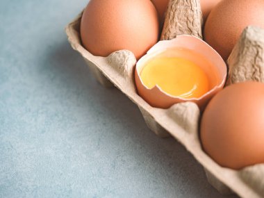 Close up image of organic chicken eggs are one of the food ingredients on the restaurant table in the kitchen to prepare for cookingwith copy space. Organic chicken eggs food ingredients concept