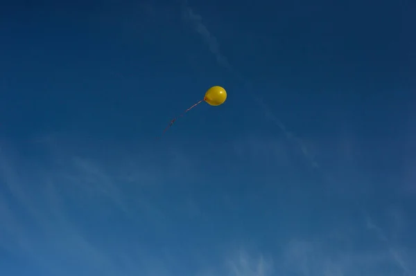 Yellow ball in the blue sky — Stock Photo, Image