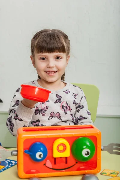 Boy and girl playing a board game — Stock Photo, Image