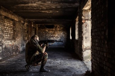 Arab soldier aiming with Kalashnikov AK-47 assault rifle clipart