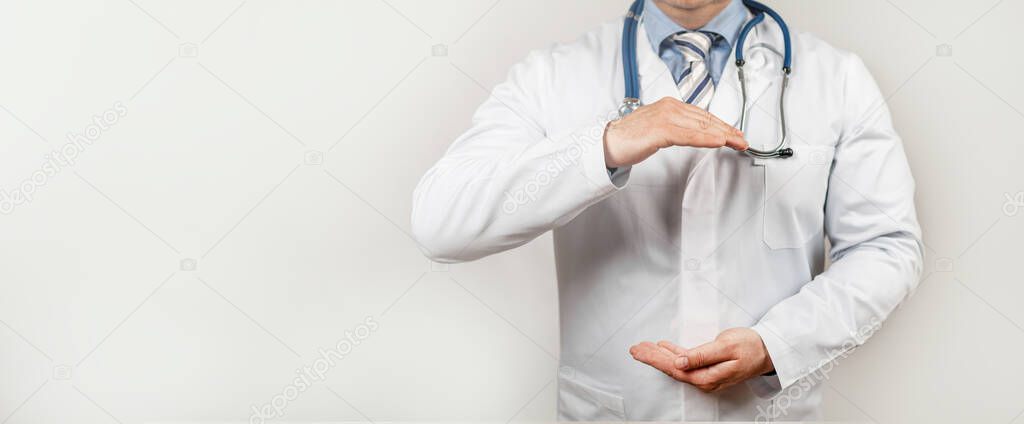 Doctor with two hands gesture health and life insurance for the whole concept