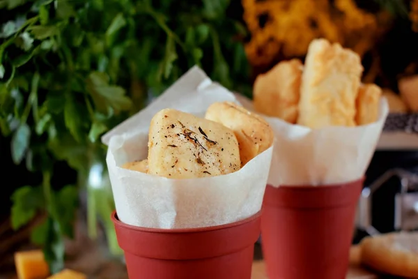 Crackers with salt and spices in tiny portion buckets