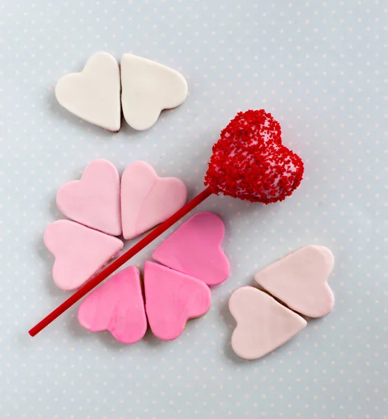 Red cakepop with hearts, blue background — Stock Photo, Image