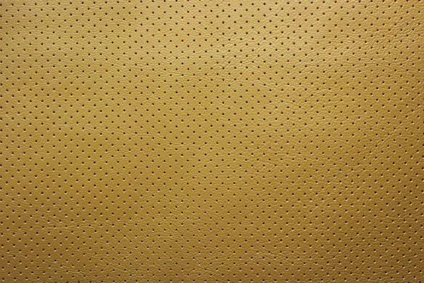 Amarelo perfurado fundo textura de couro — Fotografia de Stock